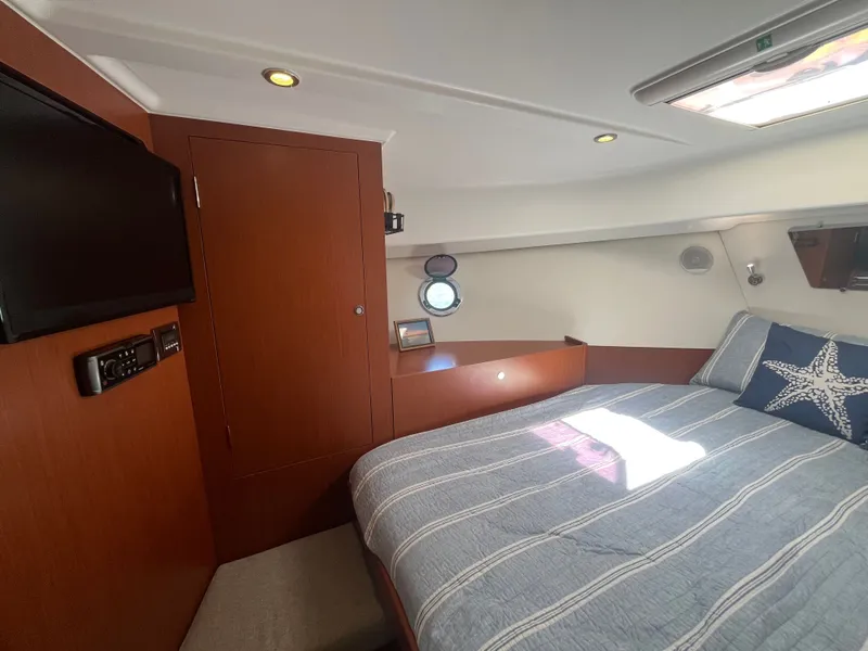 Slide: The Image of Interior of 2015 Beneteau Swift Trawler 34 Fly with bed and TV. - 18