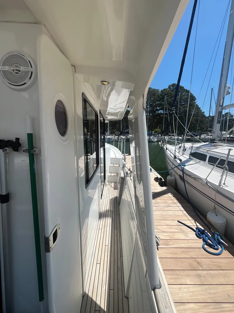 Slide: The Image of Beneteau Swift Trawler 34 Fly 2015 at dock, side view. - 32
