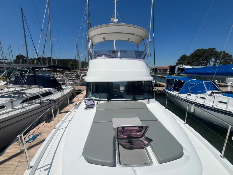 Slide: The Image of 2015 Beneteau Swift Trawler 34 Fly docked, front view. - 36