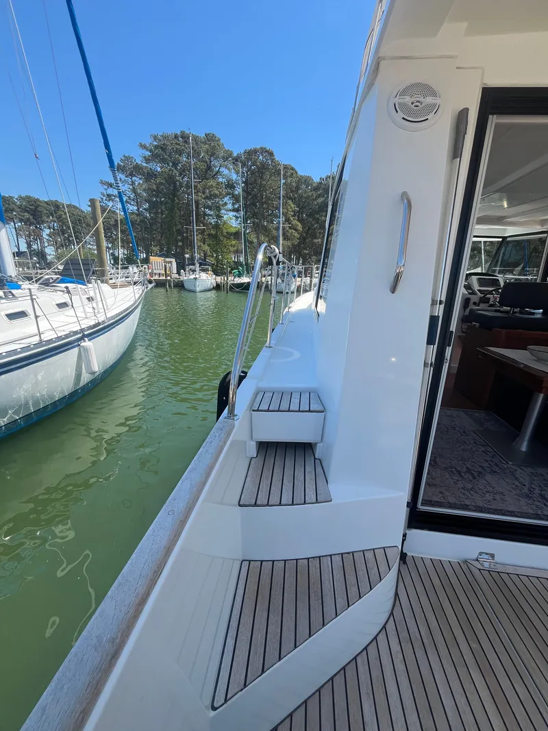 Slide: The Image of Beneteau Swift Trawler 34 Fly 2015 at dock, side view. - 40