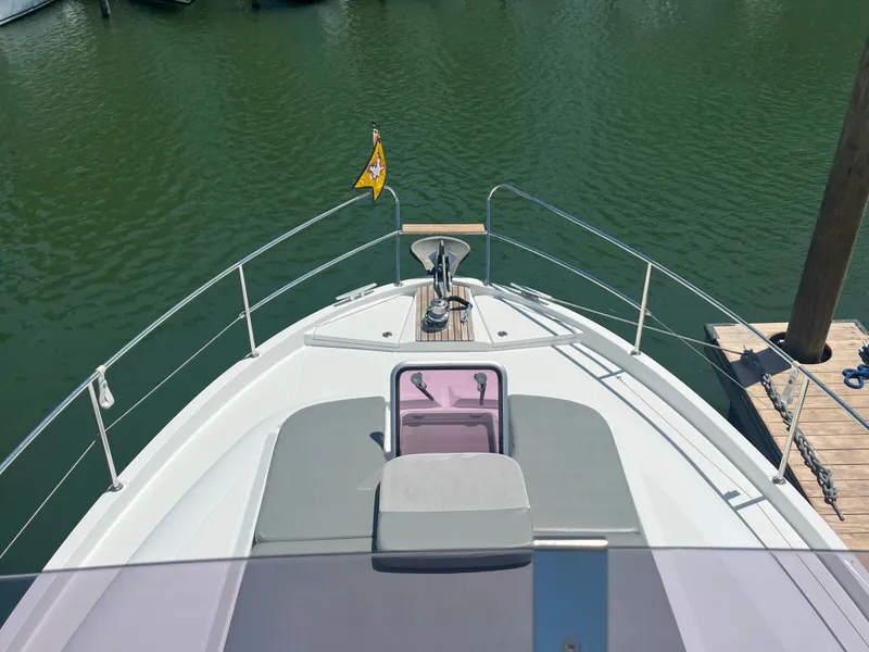 Slide: The Image of Beneteau Swift Trawler 34 Fly, bow view at dock, year 2015. - 44