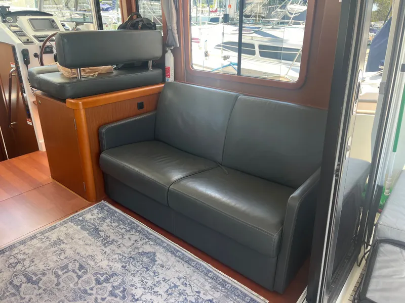 Slide: The Image of Interior of 2015 Beneteau Swift Trawler 34 Fly with leather sofa. - 8