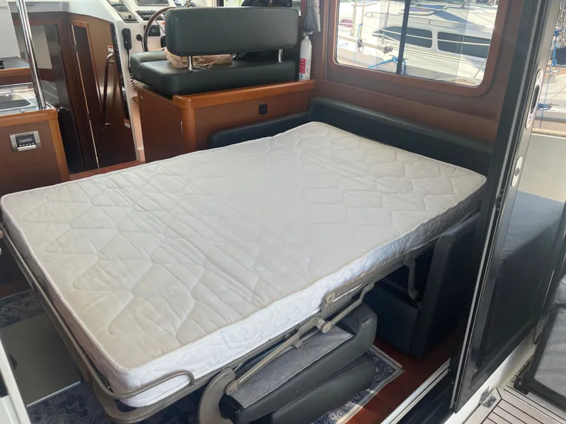 Slide: The Image of Interior of Beneteau Swift Trawler 34 Fly with unfolded bed. - 9