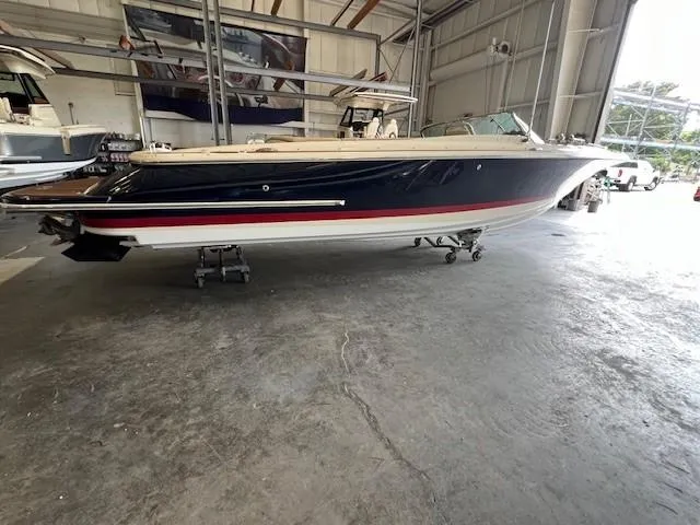 The Image of 2014 Chris-Craft Corsair 25 boat in a storage facility. - 0