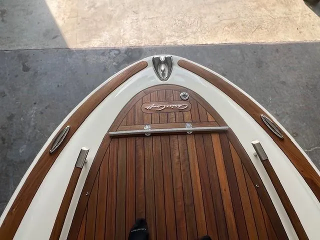 Slide: The Image of 2014 Chris-Craft Corsair 25 boat with teak deck and chrome accents. - 15