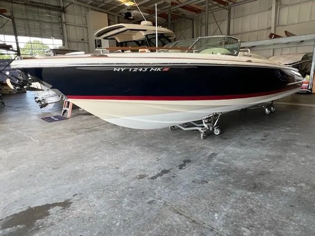 Slide: The Image of 2014 Chris-Craft Corsair 25 boat in a storage facility. - 4
