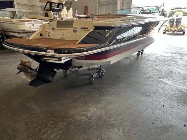 Slide: The Image of 2014 Chris-Craft Corsair 25 boat in a storage facility, rear view. - 6