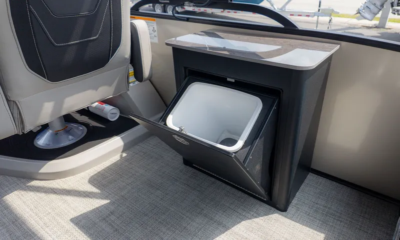 Slide: The Image of Interior of 2026 Barletta Cabrio 24UE with open storage compartment. - 24