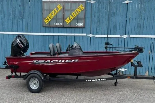 The Image of 2025 Tracker Super Guide V-16 SC boat in red, displayed at Sizzle Marine, Ohio. - 0