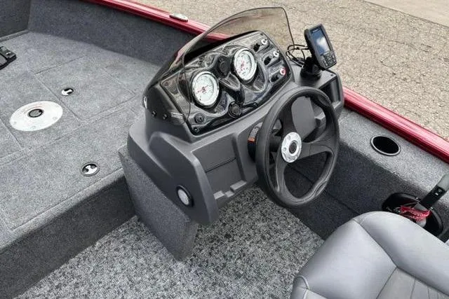 Slide: The Image of 2025 Tracker Super Guide V-16 SC boat dashboard with steering wheel and gauges. - 10