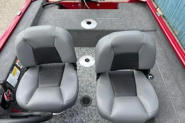 Slide: The Image of Interior of 2025 Tracker Super Guide V-16 SC boat with two gray seats. - 11