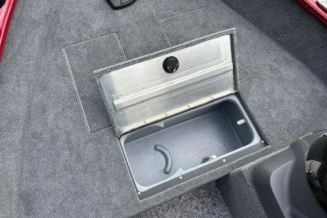 Slide: The Image of 2025 Tracker Super Guide V-16 SC boat storage compartment with open lid, showcasing interior space. - 7