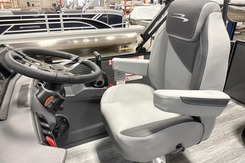 Slide: The Image of Captain's chair and steering wheel of 2026 Bennington 22 S Swingback pontoon boat. - 12
