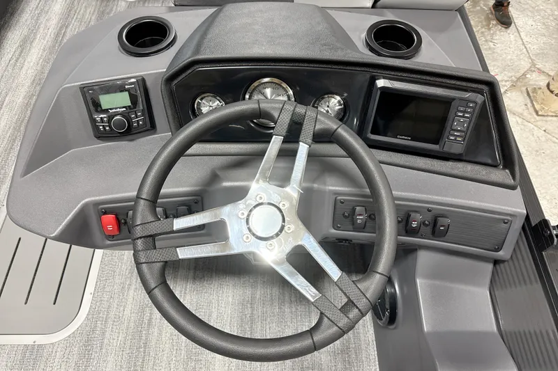 Slide: The Image of Steering console of 2026 Bennington 22 S Swingback with gauges and controls. - 13