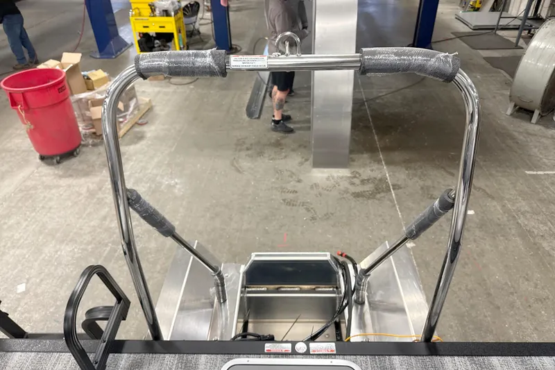 Slide: The Image of 2026 Bennington 22 S Swingback boat frame in a workshop setting. - 15