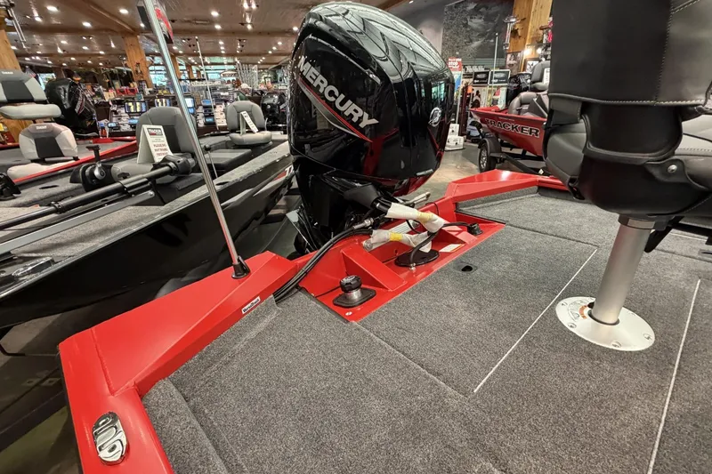 Slide: The Image of 2026 Tracker Pro Team 175 Crappie Edition boat with Mercury engine in showroom. - 5
