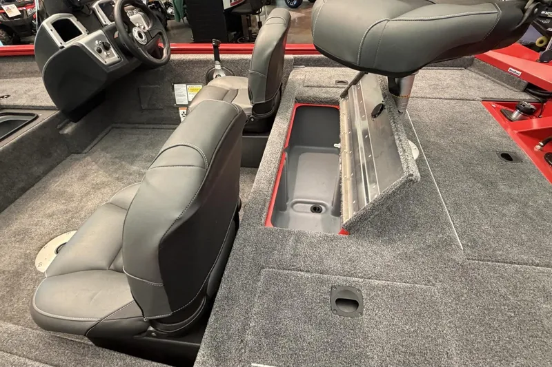 Slide: The Image of 2026 Tracker Pro Team 175 Crappie Edition boat interior with gray seating and storage compartment. - 6