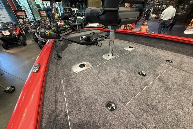 Slide: The Image of 2026 Tracker Pro Team 175 Crappie Edition boat interior with red trim and fishing seat. - 8