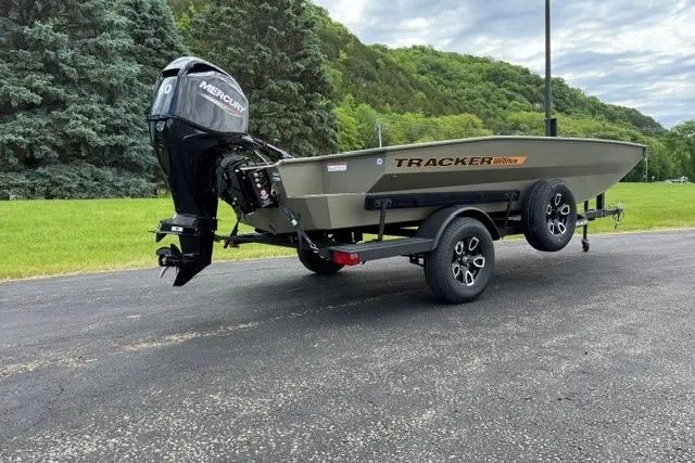 The Image of 2026 Tracker Grizzly 1756 T Marsh boat on trailer, parked outdoors. - 0