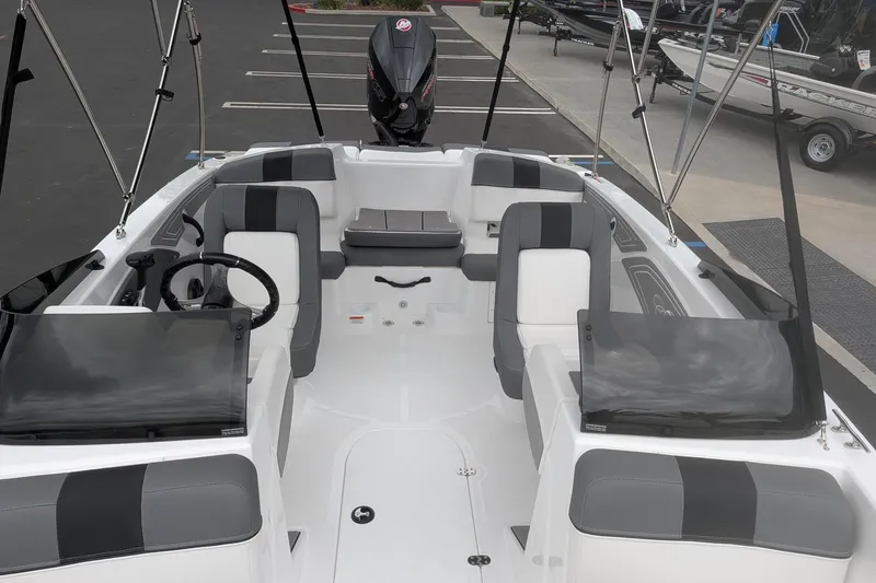 Slide: The Image of 2026 Tahoe T21 boat interior with sleek seating and modern steering wheel design. - 8