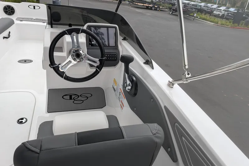 Slide: The Image of Interior view of 2026 Tahoe T21 boat cockpit with steering wheel and control panel. - 6
