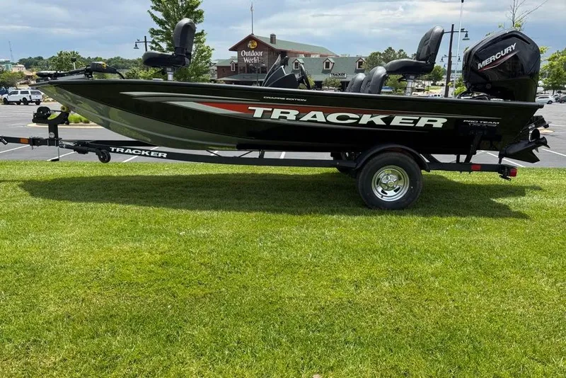 The Image of 2026 Tracker Pro Team 175 Crappie Edition boat on trailer, parked on grass. - 0