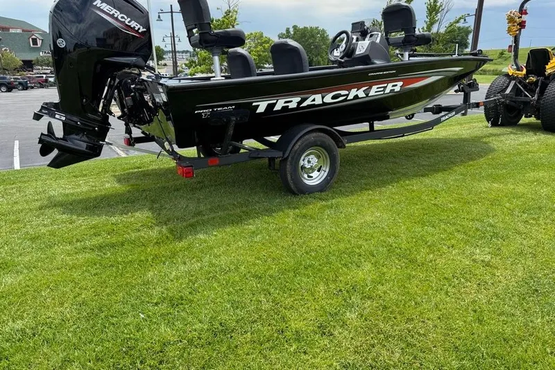 Slide: The Image of 2026 Tracker Pro Team 175 Crappie Edition boat on grass, featuring Mercury engine. - 3