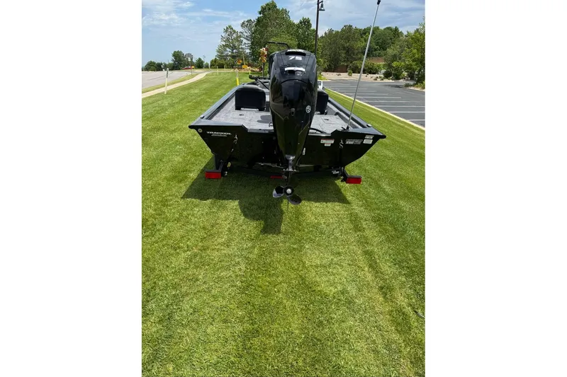 Slide: The Image of 2026 Tracker Pro Team 175 Crappie Edition boat on grass, rear view. - 4