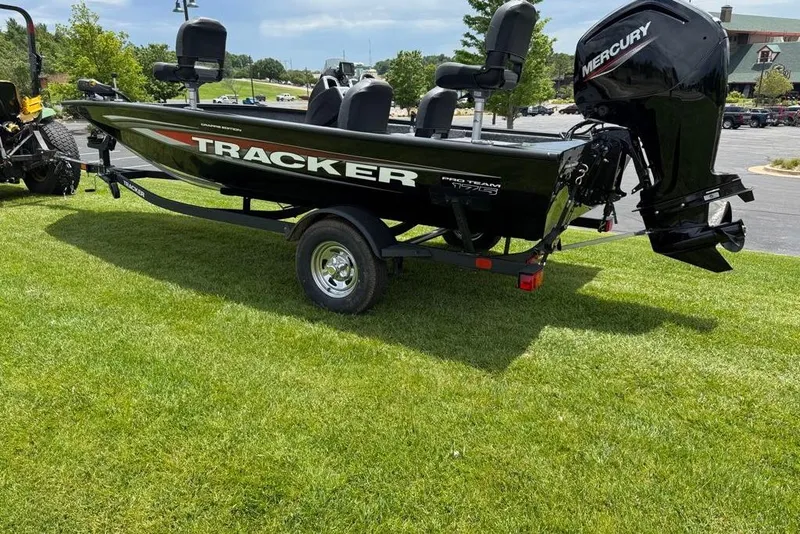 Slide: The Image of 2026 Tracker Pro Team 175 Crappie Edition boat on trailer, parked on grass. - 6