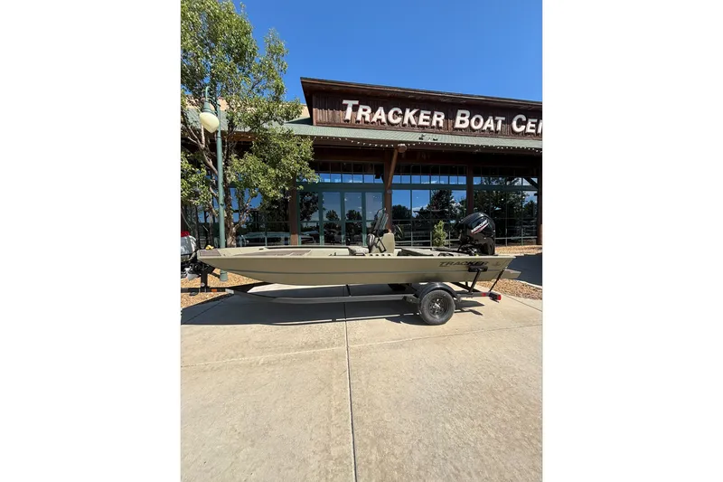 The Image of 2026 Tracker Grizzly 1860 CC boat on trailer outside Tracker Boat Center. - 0