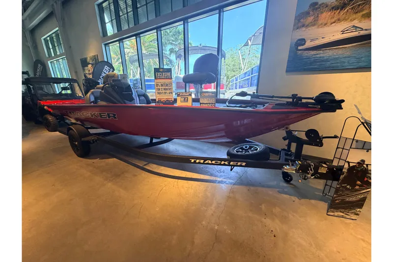 The Image of 2026 Tracker Pro Team 195 boat displayed indoors with promotional signage. - 0