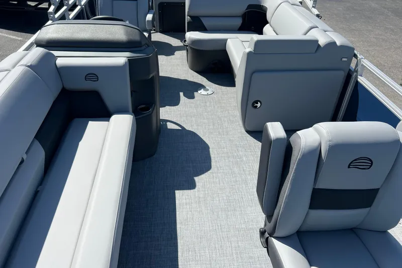Slide: The Image of 2026 Sun Tracker SportFish 20 DLX pontoon boat interior with gray seating and flooring. - 4