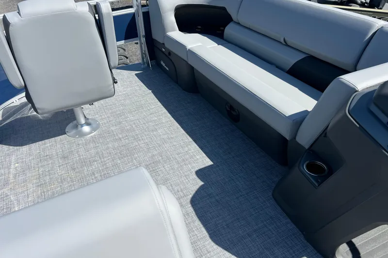 Slide: The Image of Interior of 2026 Sun Tracker SportFish 20 DLX pontoon boat with gray seating and flooring. - 6