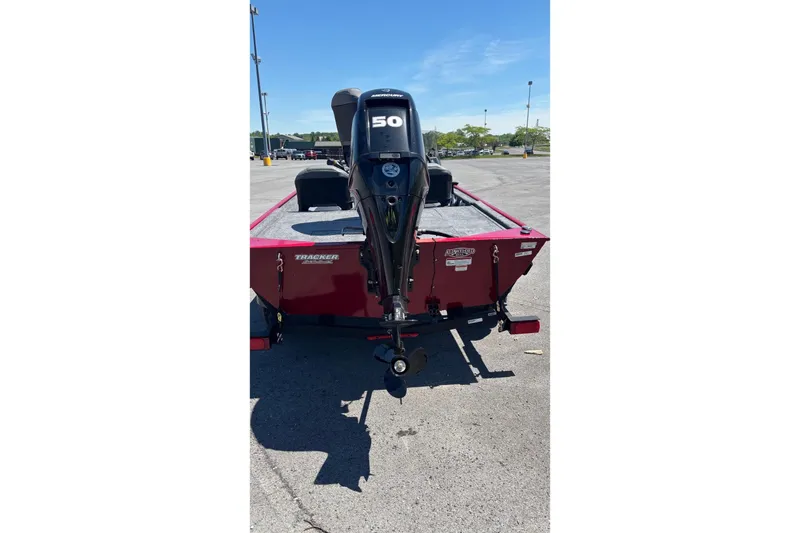 Slide: The Image of 2026 Tracker Bass Tracker Classic XL boat with Mercury 50 HP engine in parking lot. - 59