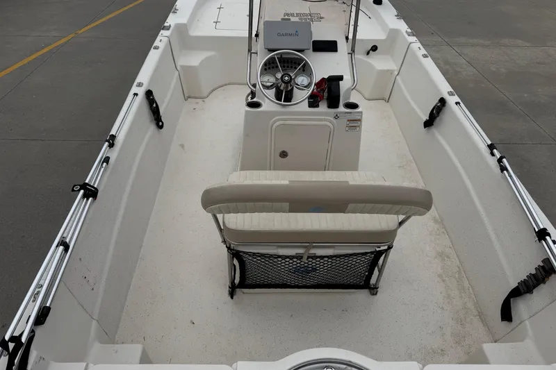 Slide: The Image of Interior view of a 2016 Carolina Skiff 218 DLV boat with helm console. - 13