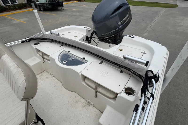 Slide: The Image of 2016 Carolina Skiff 218 DLV with Yamaha motor on parking lot. - 15