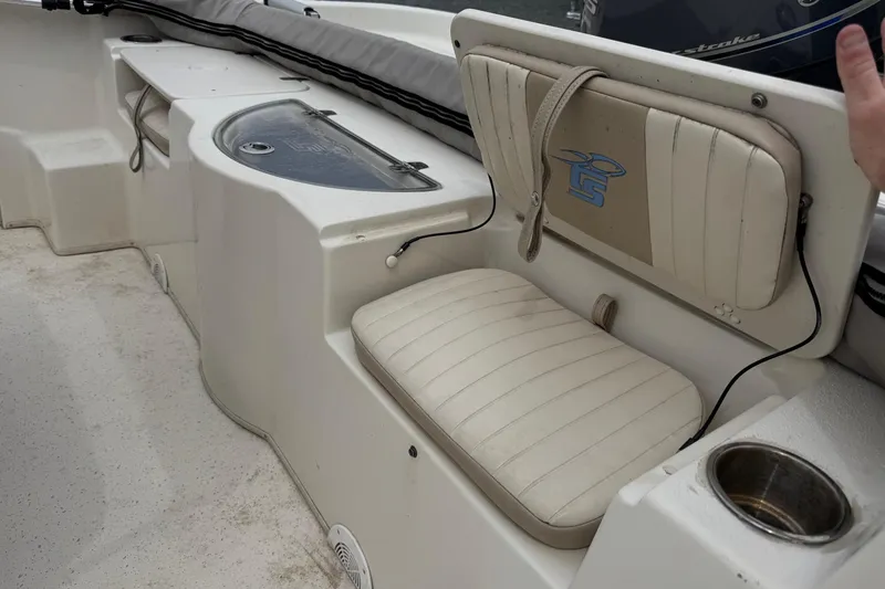 Slide: The Image of Interior of 2016 Carolina Skiff 218 DLV with seating and storage. - 16