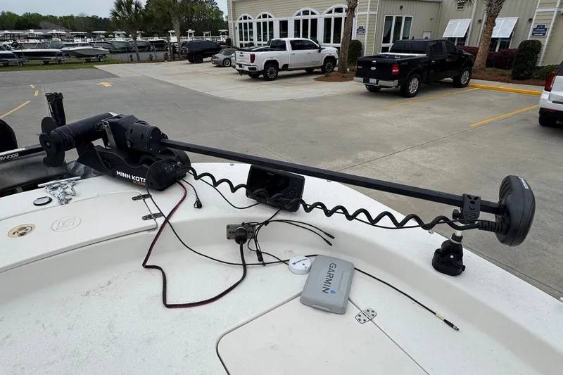 Slide: The Image of 2016 Carolina Skiff 218 DLV with Minn Kota trolling motor and Garmin device. - 19