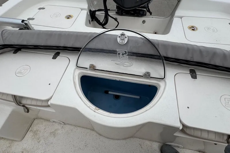 Slide: The Image of 2016 Carolina Skiff 218 DLV boat with storage and motor. - 21