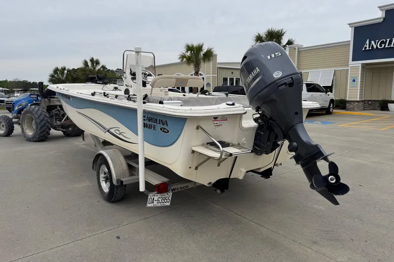 Slide: The Image of 2016 Carolina Skiff 218 DLV boat with Yamaha motor on trailer. - 3