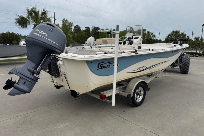 Slide: The Image of 2016 Carolina Skiff 218 DLV boat with Yamaha motor on trailer. - 5