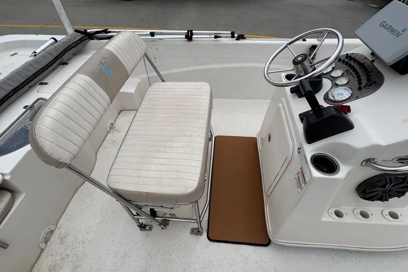 Slide: The Image of Interior of a 2016 Carolina Skiff 218 DLV with helm console. - 9