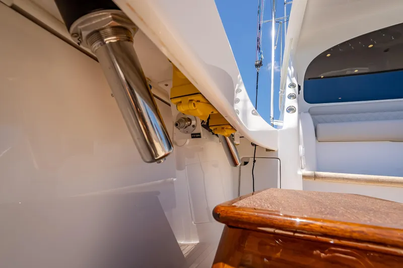 Slide: The Image of 2026 Viking 54 Convertible yacht interior with polished metal fixtures and wooden accents. - 27