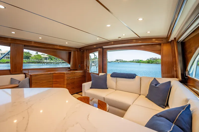Slide: The Image of Luxurious interior of 2026 Viking 54 Convertible yacht with elegant wood finishes and waterfront view. - 29