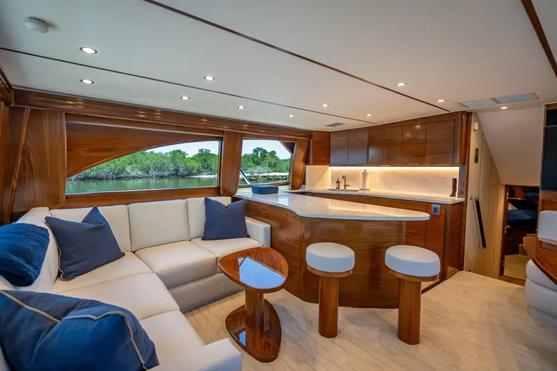 Slide: The Image of Luxurious interior of 2026 Viking 54 Convertible yacht with modern kitchen and seating area. - 31