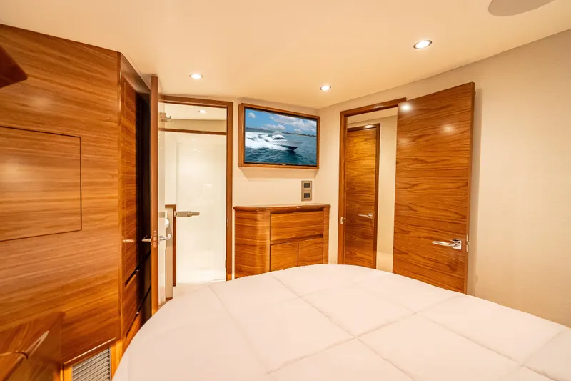 Slide: The Image of Luxurious cabin interior of 2026 Viking 54 Convertible yacht with wood finishes and modern amenities. - 43