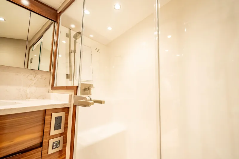 Slide: The Image of Luxurious bathroom interior of 2026 Viking 54 Convertible yacht with modern fixtures. - 55