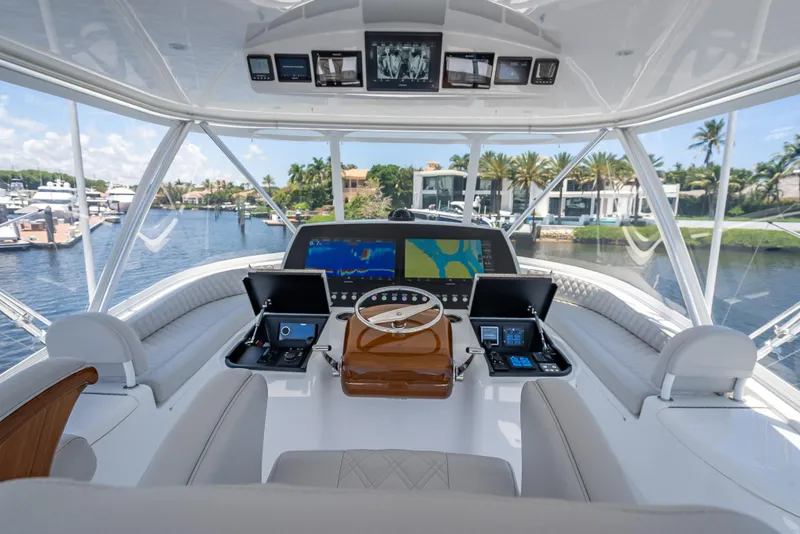Slide: The Image of Luxurious helm of 2026 Viking 54 Convertible yacht with advanced navigation systems. - 63