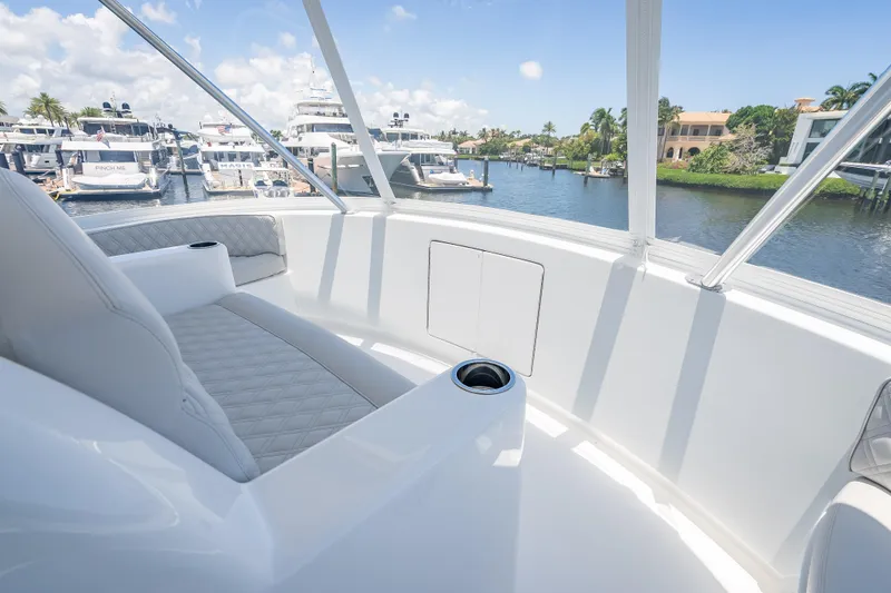 Slide: The Image of Luxurious interior of 2026 Viking 54 Convertible yacht with marina view. - 64