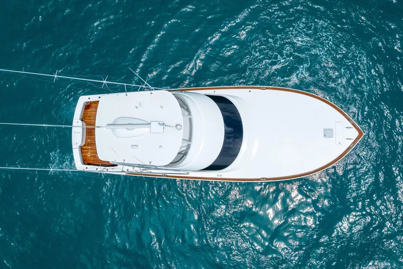 Slide: The Image of Aerial view of 2026 Viking 54 Convertible yacht on blue ocean water. - 7